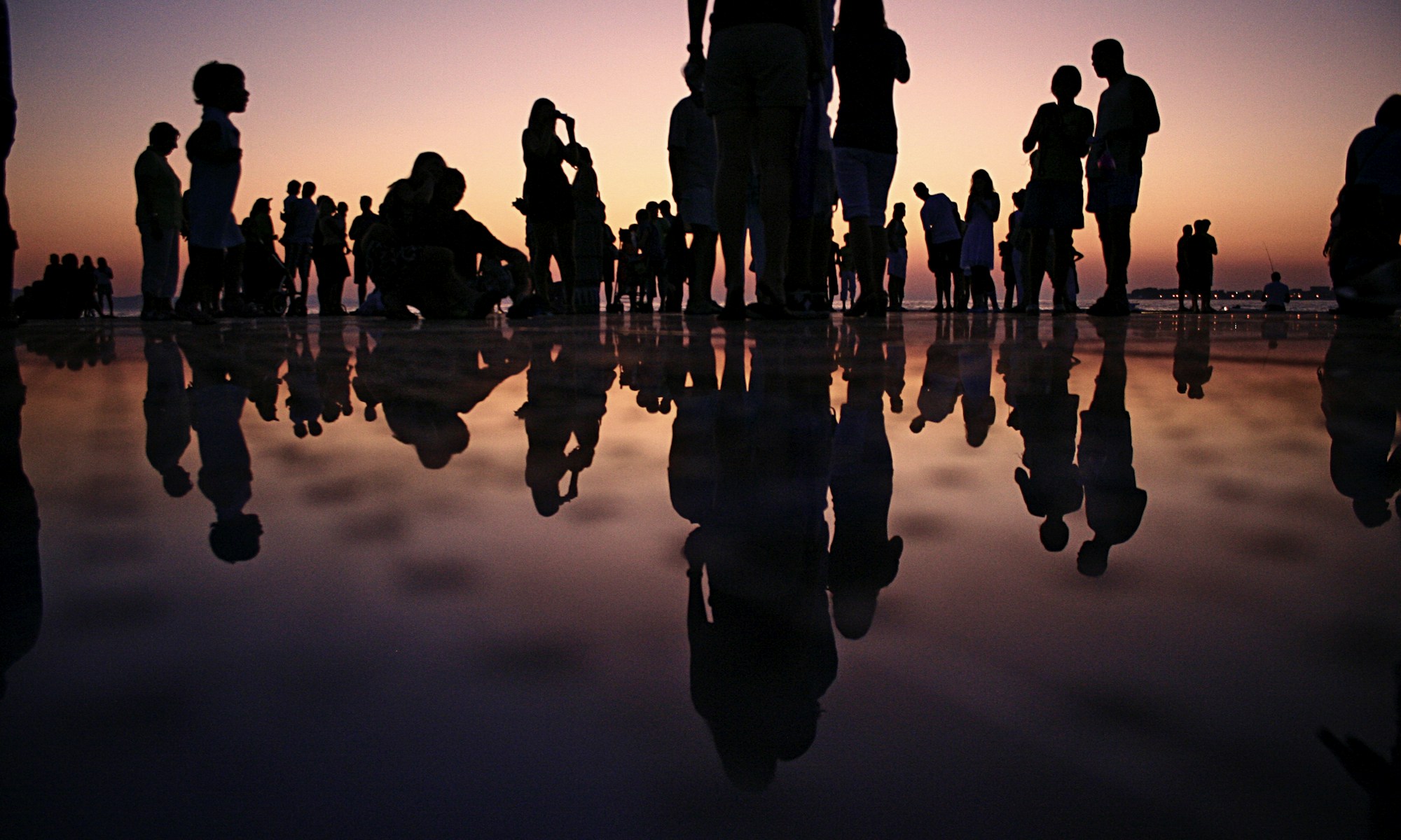 #RaiseTheGameJam. silhouette of people standing on mirror during golden hour