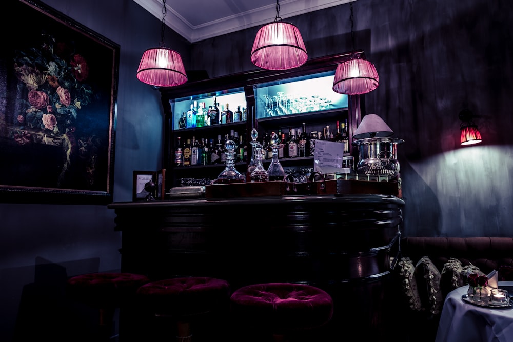 pink pendant lamps on bar area