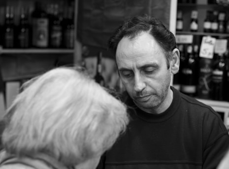 A captivating photograph of a journalist interviewing a business owner.