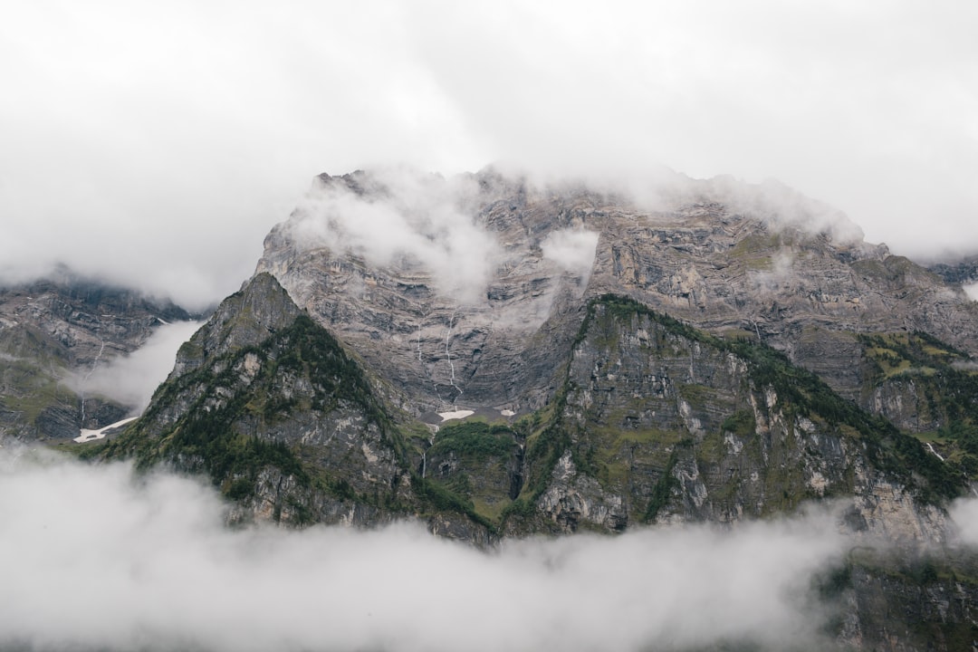 mountain covered by clouds