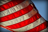 A close-up of a Kurdish flag waving proudly in the wind.