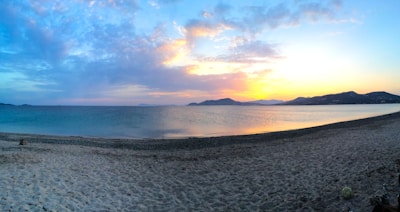 Scenic view of a serene beach in Sindhudurg at sunset.