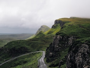 concrete road between mountains