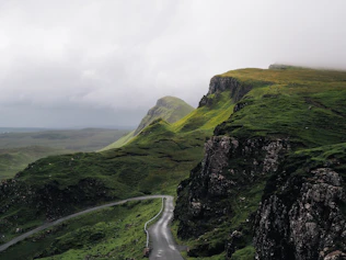 concrete road between mountains