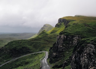 concrete road between mountains