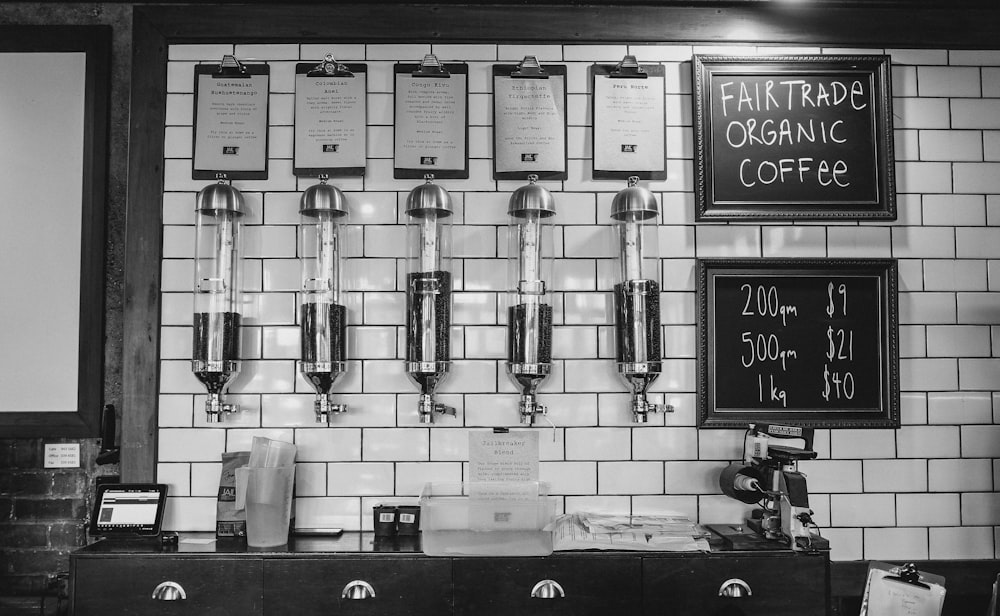 coffee bar with five coffee beans in dispensers on the wall