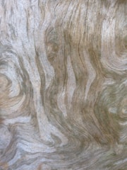Close-up of a wooden table with intricate grain patterns.