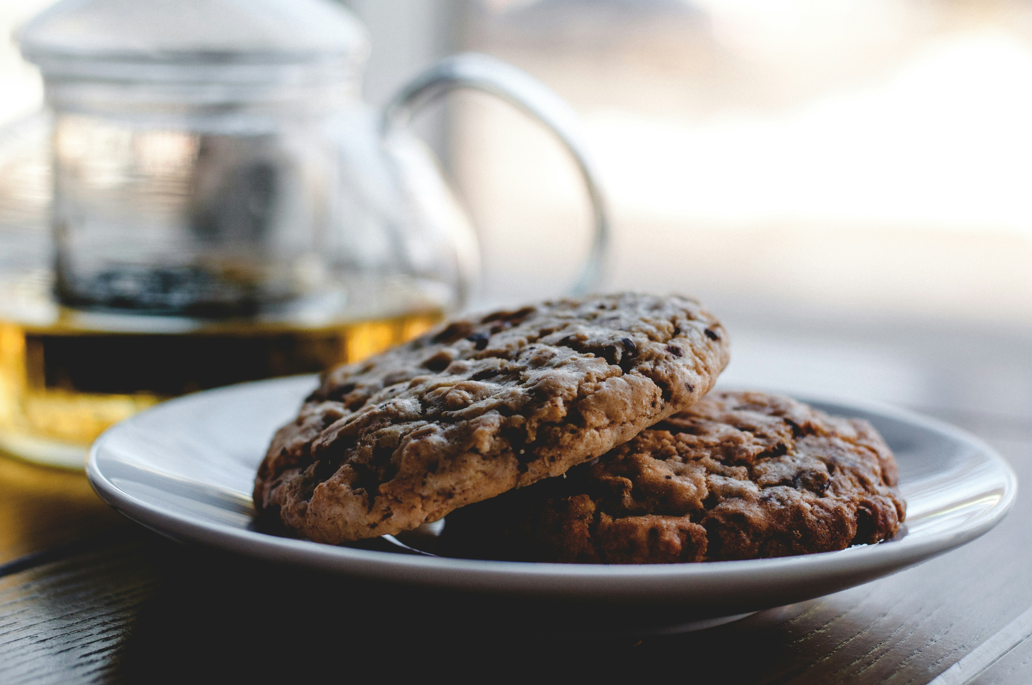 two cookies on white ceramic plate