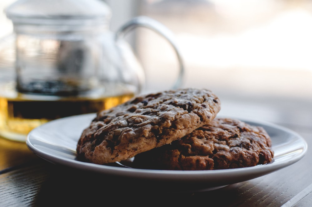 two cookies on white ceramic plate