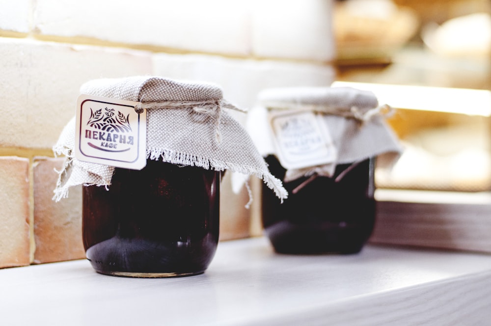 shallow focus photography of clear glass jar