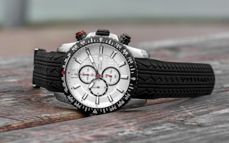 Sporty men's watch with a robust design and rubber strap on a wrist outdoors