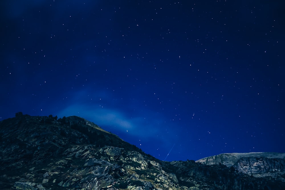 low angle photography of mountain during nighttime
