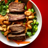 Healthy meal prep bowl with colorful vegetables and lean protein.