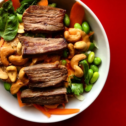 A vibrant bowl of fresh colorful vegetables and proteins, reflecting healthy eating.