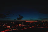 Bratislava cityscape at dusk with subtle blue-violet gradient overlay reflecting agency’s location
