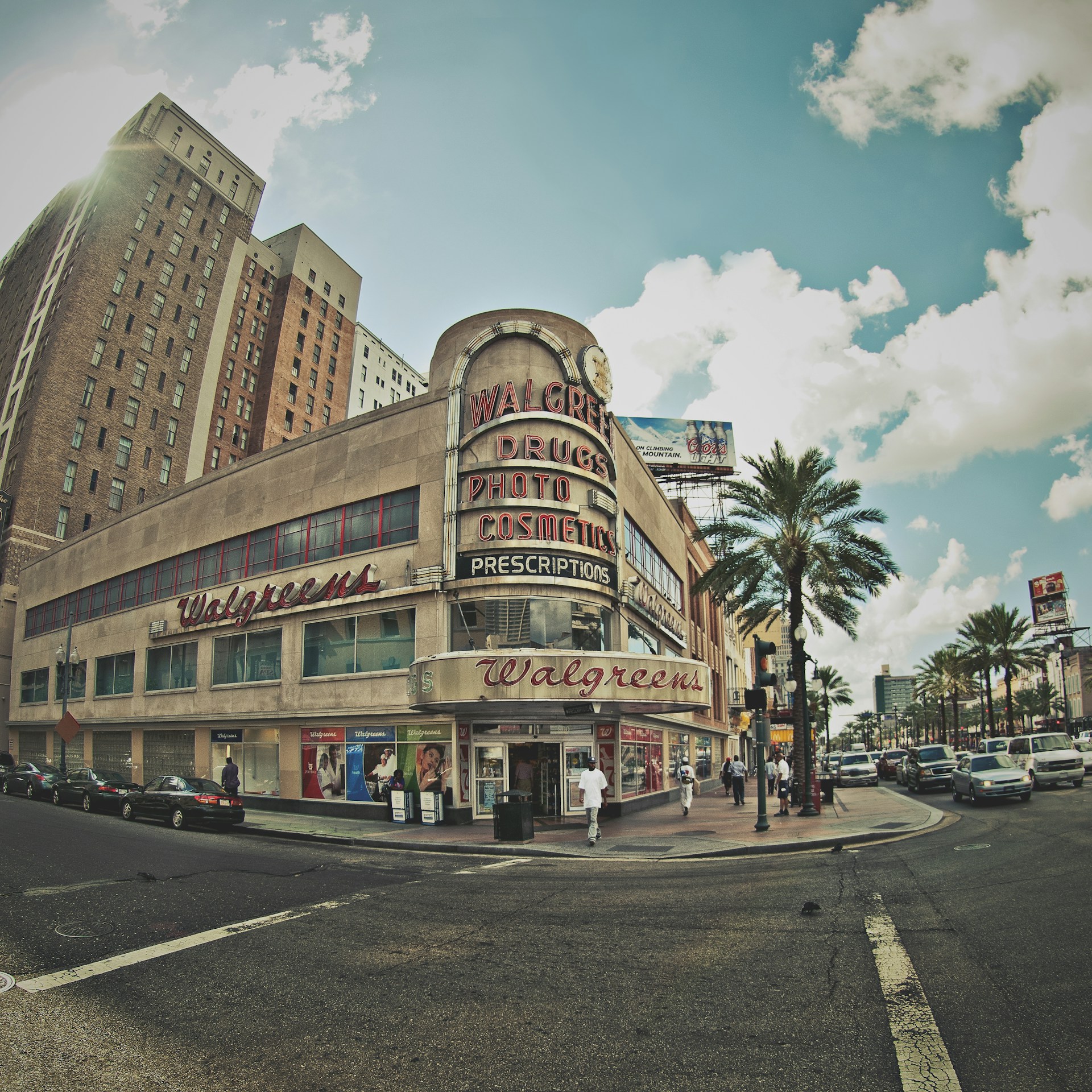 woman wearing yellow long-sleeved dress under white clouds and blue sky during daytime