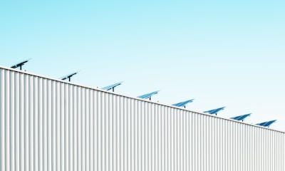 parabolic antenna on white roof