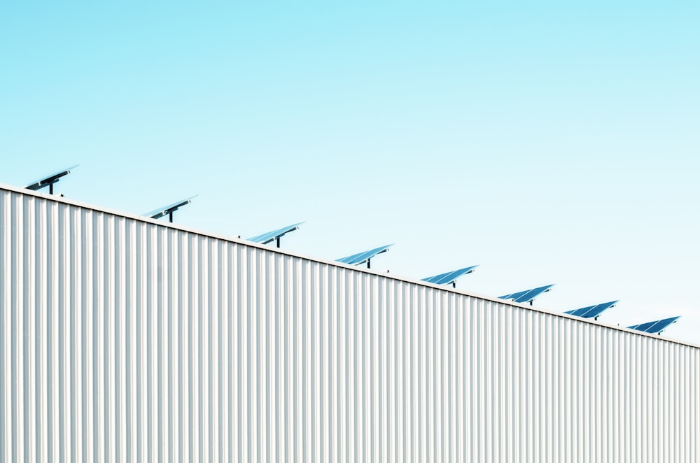 parabolic antenna on white roof