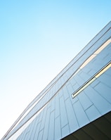 a tall building with a sky background