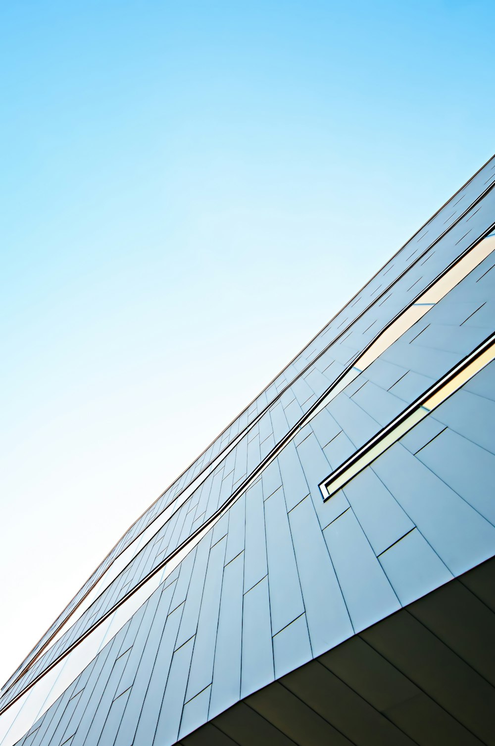 a tall building with a sky background