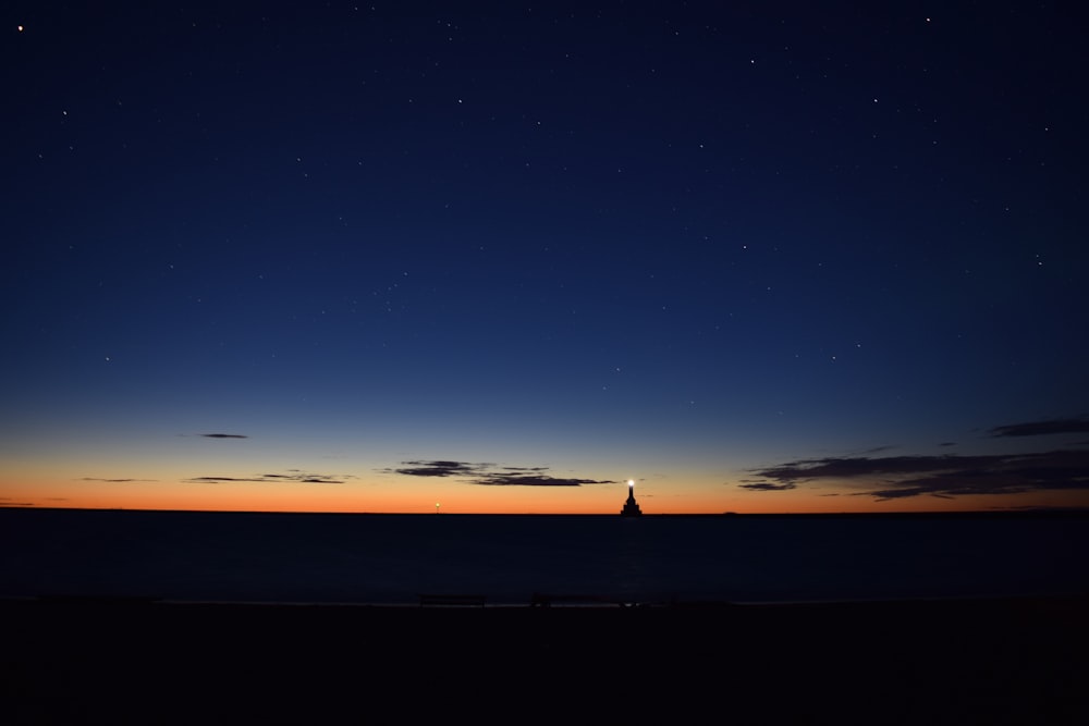 lighthouse on body of water