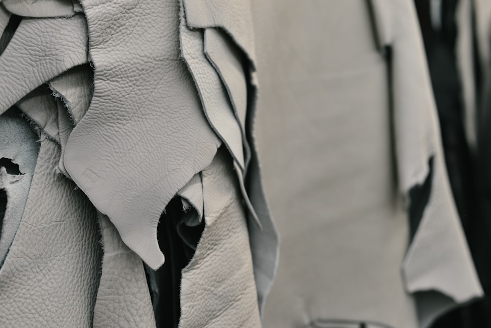 a close up of a white leather chair