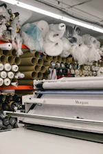 assorted rolled fabrics on display