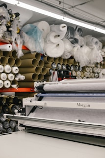 assorted rolled fabrics on display