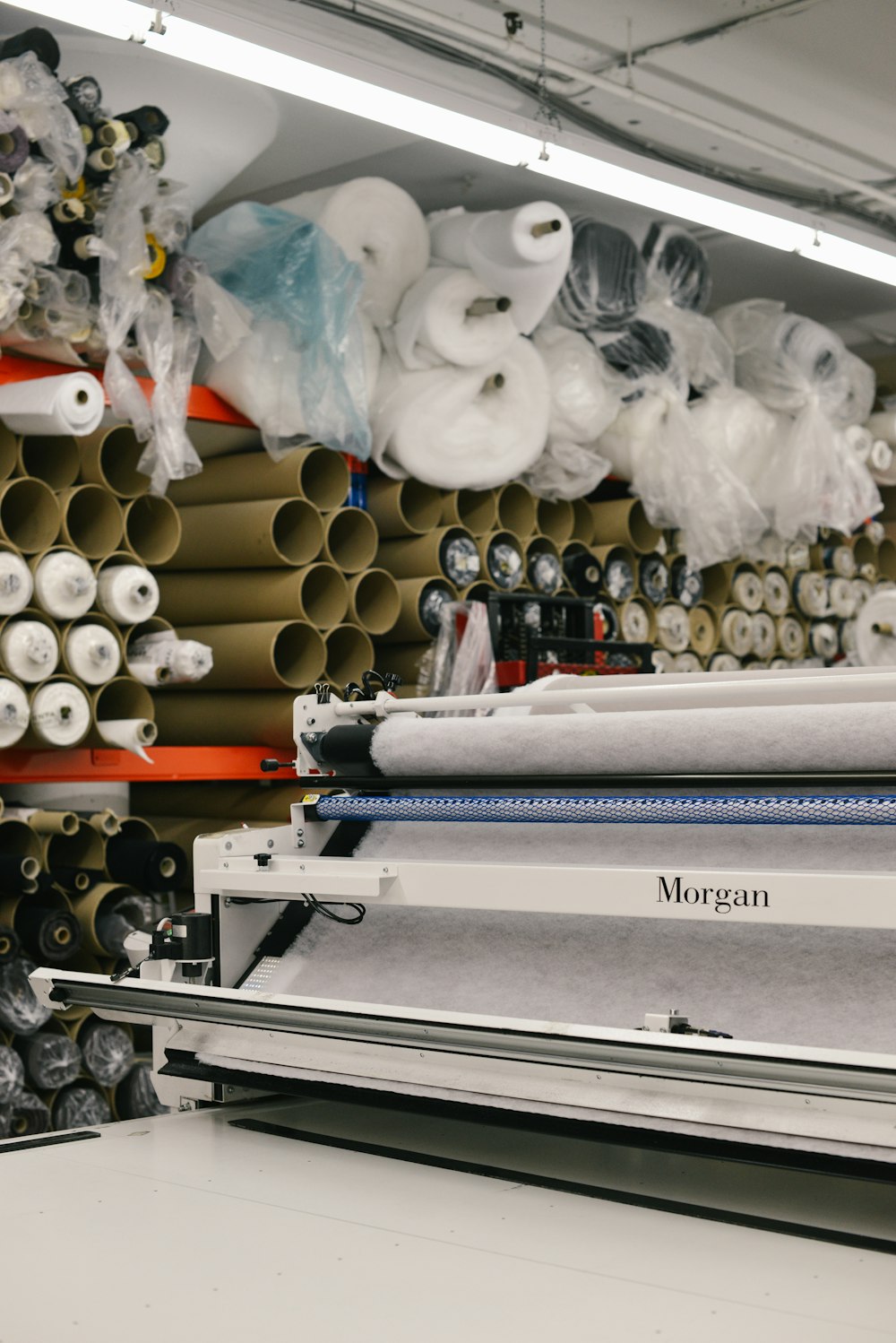 assorted rolled fabrics on display