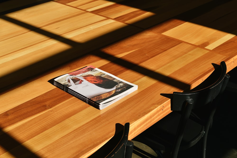 white labeled book on brown table