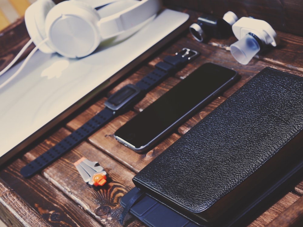 black Android smartphone on brown wooden table