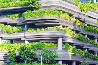 gray concrete building covered trees