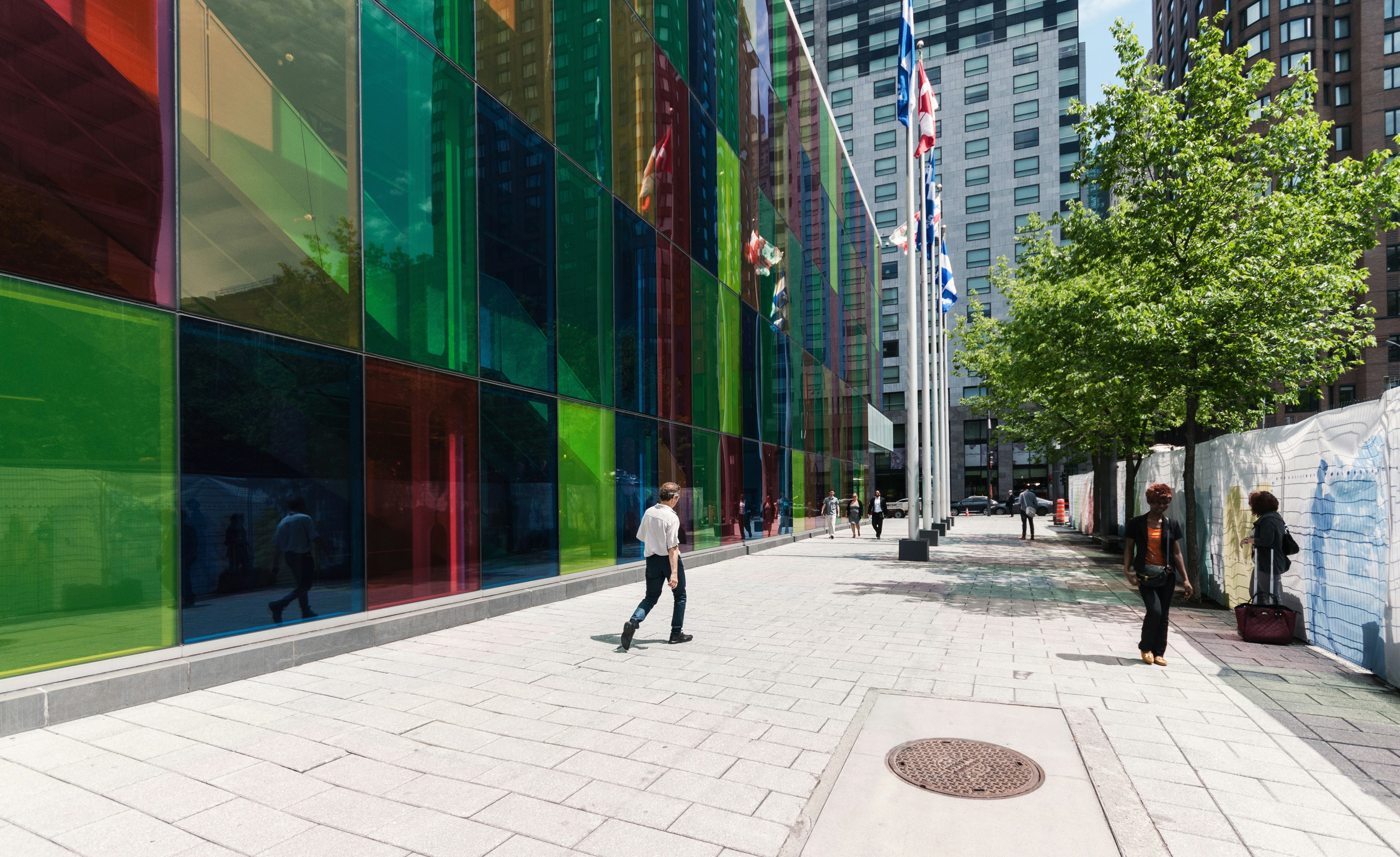 man walking beside building