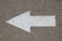 white arrow road sign
