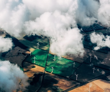 aerial photo of wind turbines near field