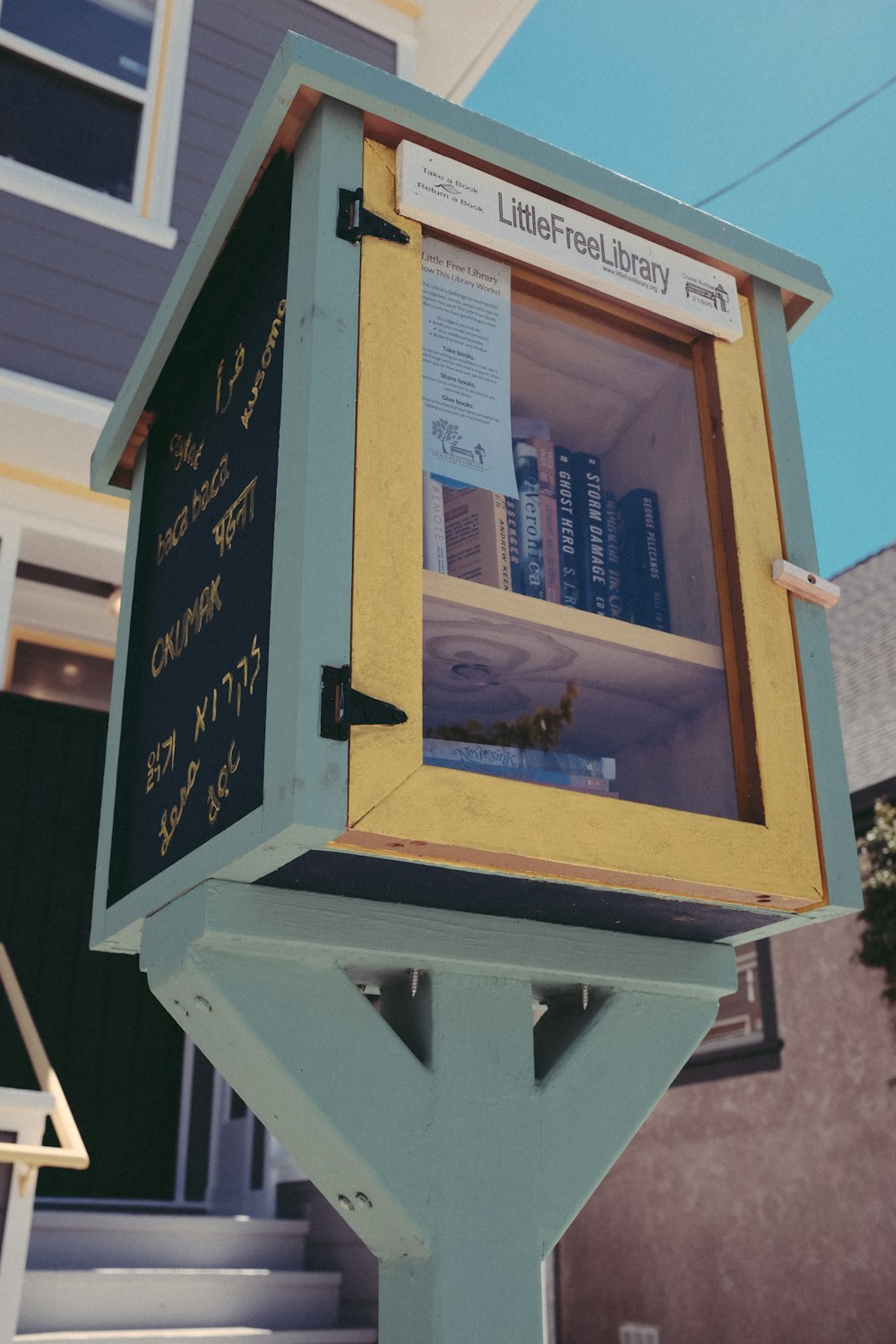 closed brown and gray Little Free Library