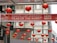 Red lanterns are hanging overhead in an urban area with a banner wishing a happy and prosperous Year of the Rabbit. The backdrop consists of modern buildings with glass windows and neutral colors.