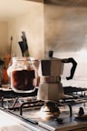 gray and black moka pot on top of gray gas range oven
