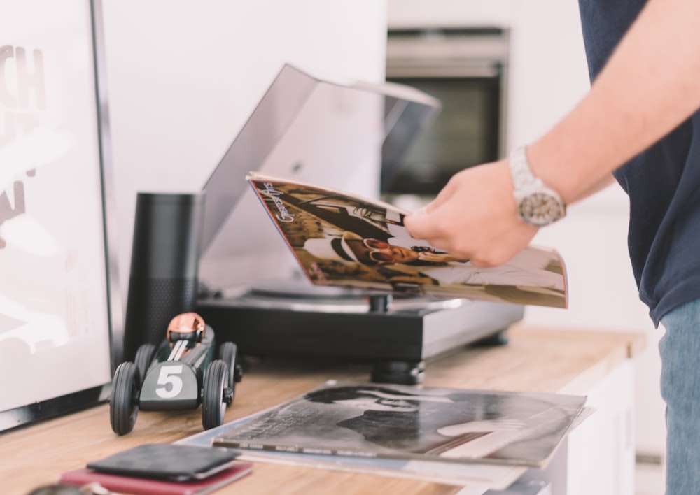 person holding record sleeve