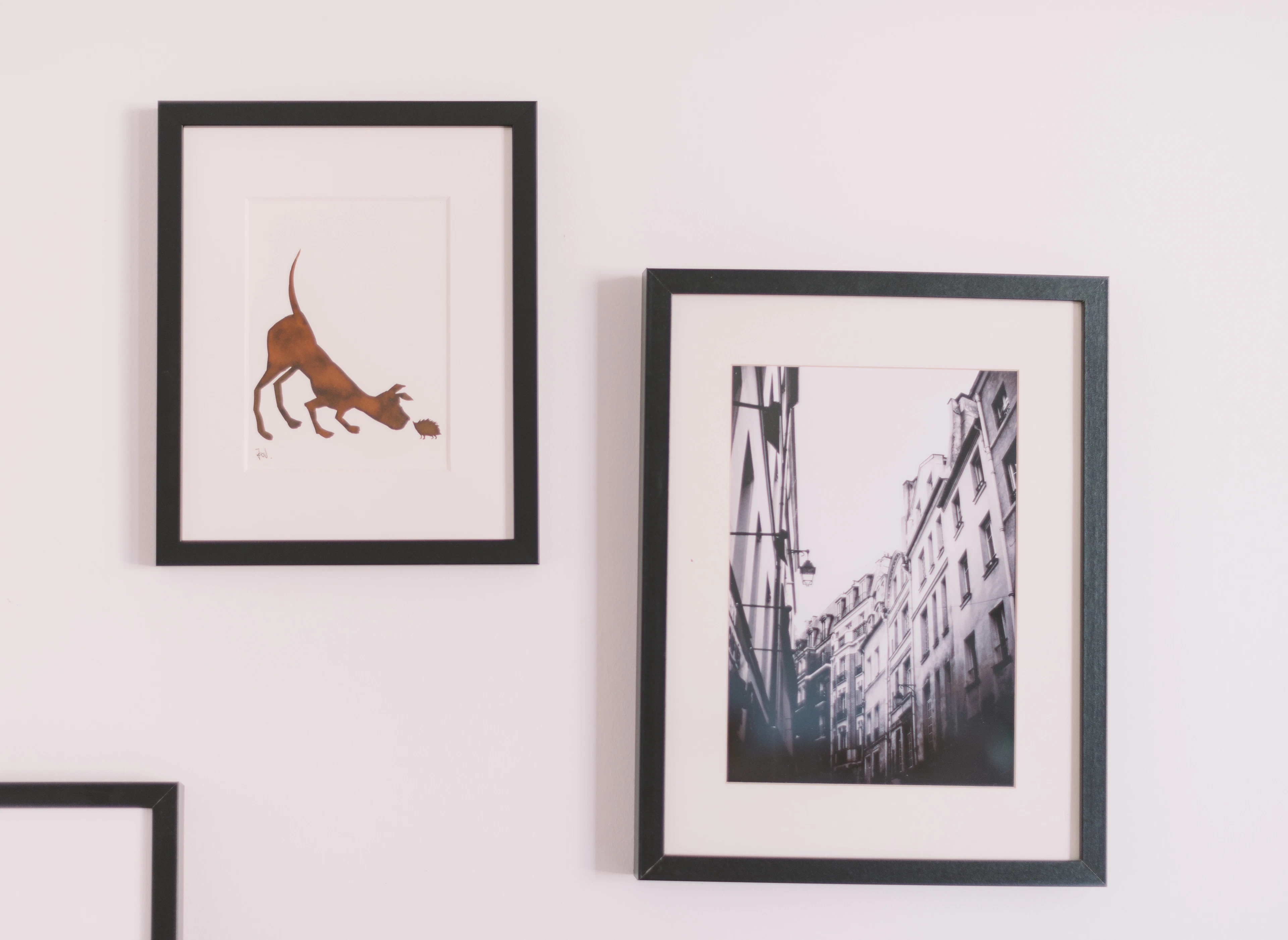Two decorative frames on a wall
