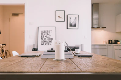 Close-up of elegant, minimalist home decor items arranged on a wooden table.