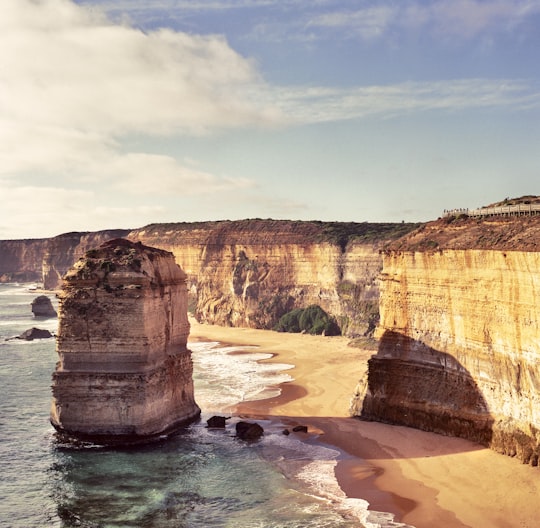 beige rock on body of water in Twelve Apostles Australia