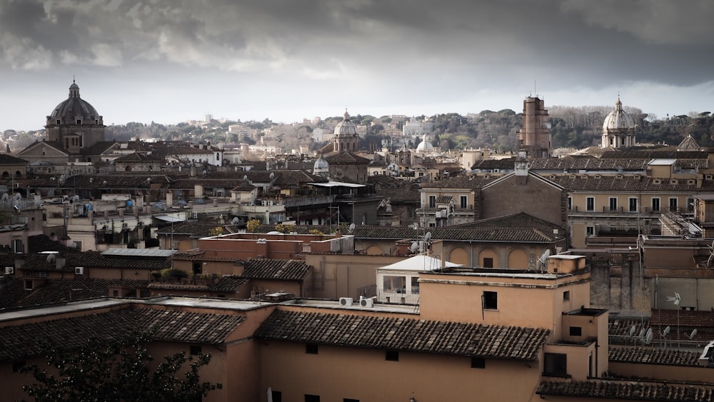 concrete buildings under gray sky at daytime