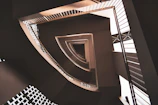 Architectural detail of a custom-designed staircase with fine lines and shadows.