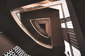 Architectural detail of a custom-designed staircase with fine lines and shadows.