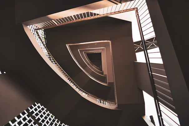 Architectural detail of a custom-designed staircase with fine lines and shadows.