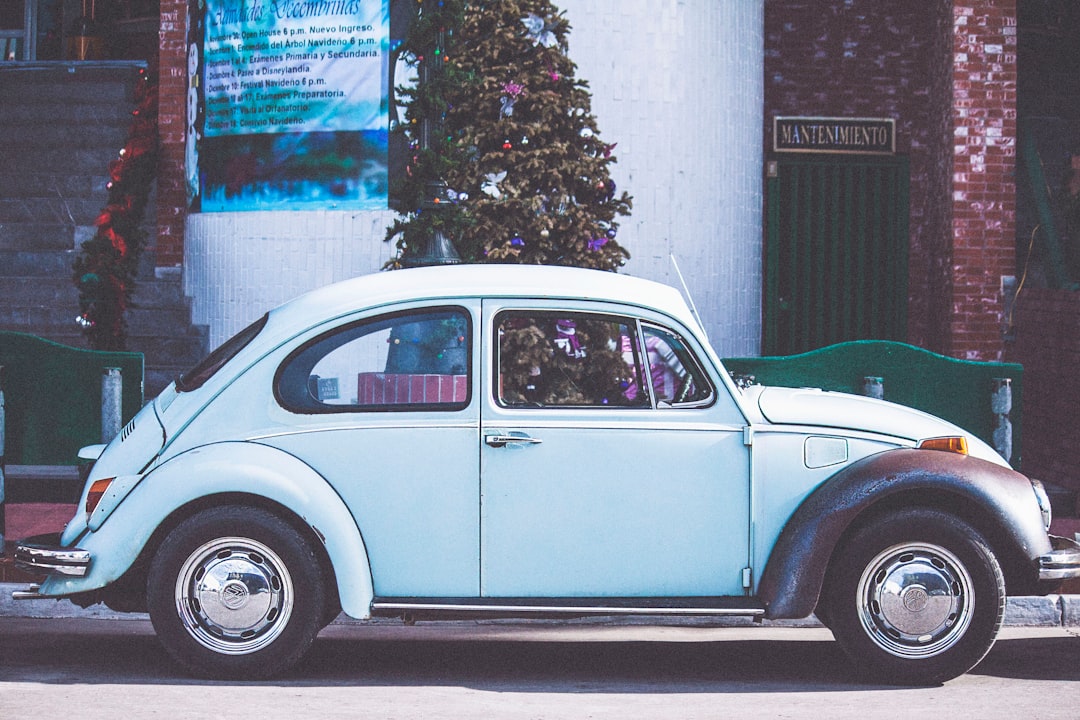 vintage white car near Christmas tree