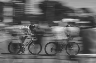 two persons riding on bicycles