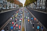 people running on road during daytime