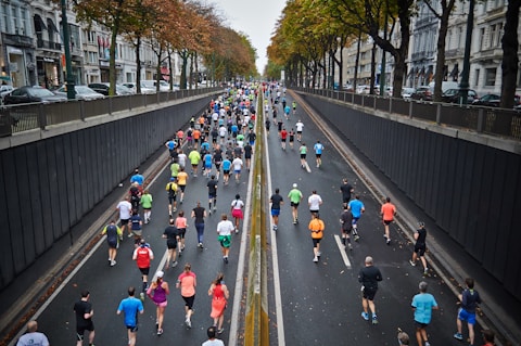 people running on road during daytime